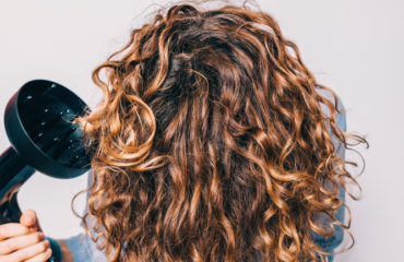So, what is the best way to style curly hair keeping it natural, without it looking to crunchy? This is a very long question because it depends on the texture and thickness of your hair. For instance, your hair may be fine and have a little wave in which you want to make into a stronger curl. Or you may have the opposite situation you may have very thick course hair and may want to weigh down your hair and relax the curl a little. There is one thing for sure. There is no one size fits all method for styling curly hair, it’s more of a trial effort to work out what suits YOUR hair the best.